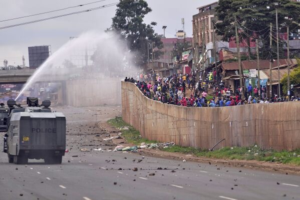 ADDITION: CLARIFIES DATE - Riot police scatter protesters with water cannons during demonstrations to mark the historic 1990 Saba Saba (a Swahili word that means seven seven) protests for democratic reforms in the Kangemi slum of Nairobi, Kenya, Monday, July 7, 2025. (AP Photo/Brian Inganga)