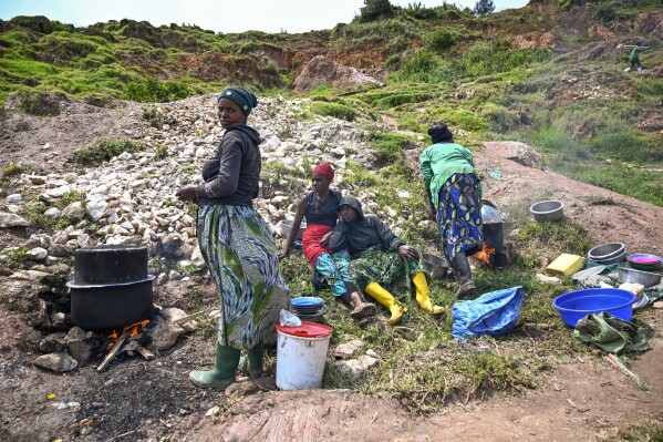 Women prepare food for miners at the D4 Gakombe coltan quarry in Rubaya, Democratic Republic of Congo, on Friday, May 9, 2025. (AP Photo/Moses Sawasawa)