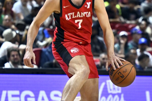 Atlanta Hawks forward Nikola Durisic handles the ball against the Washington Wizards during the first half of an NBA summer league basketball game July 12, 2024, in Las Vegas. (AP Photo/David Becker, File)