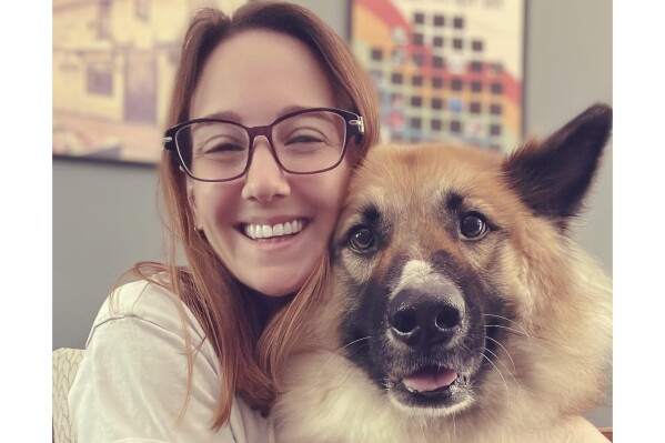 This undated photo released by Frankie Jackson, a UK-registered veterinary nurse and certified animal behavior consultant, shows Jackson with her dog, Rook, at her home in Smyrna, Ga. (AP Photo/Frankie Jackson)