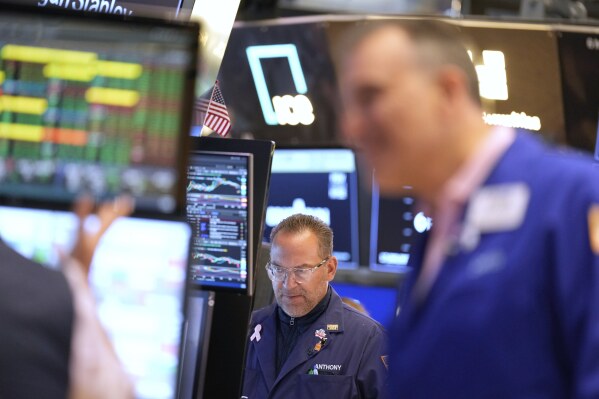Anthony Matesic works on the floor at the New York Stock Exchange in New York, Wednesday, July 16, 2025. (AP Photo/Seth Wenig)