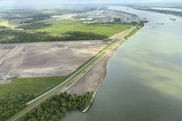 The nearly $3 billion Mid-Barataria Sediment Diversion project along the Mississippi River, intended to stave off coastal land loss in southeastern Louisiana, is seen during a flyover with the environmental coalition group Restore the Mississippi River Delta, Aug. 29, 2024. (AP Photo/Jack Brook, File)