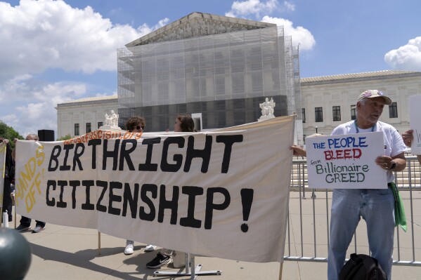 Demonstrators holds up a banner during a citizenship rally outside of the Supreme Court in Washington, May 15, 2025. (AP Photo/Jose Luis Magana, File)