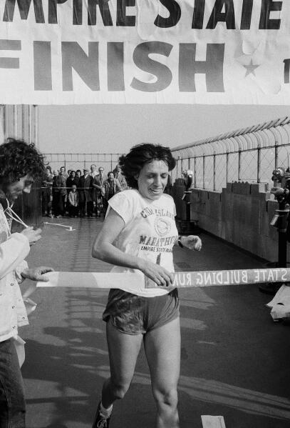Nina Kuscsik, of Huntington, L.I., runs across finish line atop the Empire State Building Thursday, Feb. 14, 1980 in New York. (AP Photo/Ron Frehm,File)