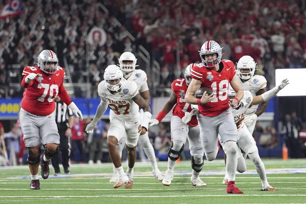 Ohio State quarterback Will Howard (18) runs against Texas during the second half of the Cotton Bowl College Football Playoff semifinal game, Jan. 10, 2025, in Arlington, Texas. (AP Photo/Julio Cortez, File)