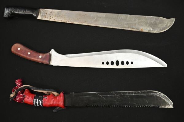 Machete are on display during an announcement at Victoria Police Headquarters in Melbourne, Australia, Thursday, March 13, 2025. (James Ross/AAP Image via AP)