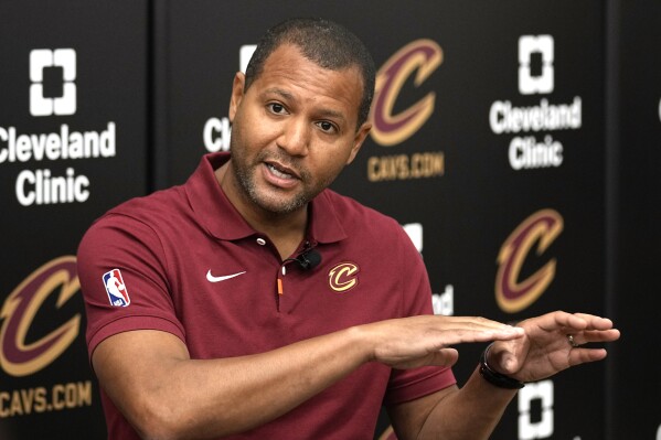 Koby Altman, president of basketball operations for the Cleveland Cavaliers, answers a question at a news conference in Independence, Ohio, Friday, May 24, 2024. (AP Photo/Sue Ogrocki, File)