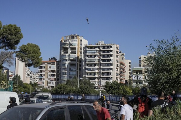 A bomb dropped from an Israeli jet hits a building in Ghobeiri, Beirut, Lebanon, Tuesday, Oct. 22, 2024. (AP Photo/Bilal Hussein)