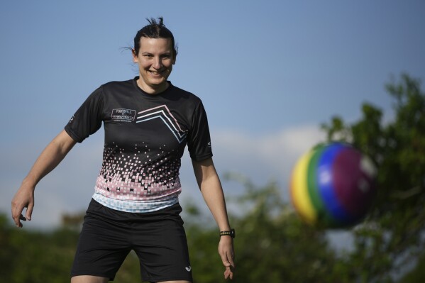 Transgender soccer player Natalie Washington, who leads the group "Football v Transphobia", takes part in a casual kickaround with some friends in Guildford, England, Thursday, May 8, 2025. (AP Photo/Alastair Grant)