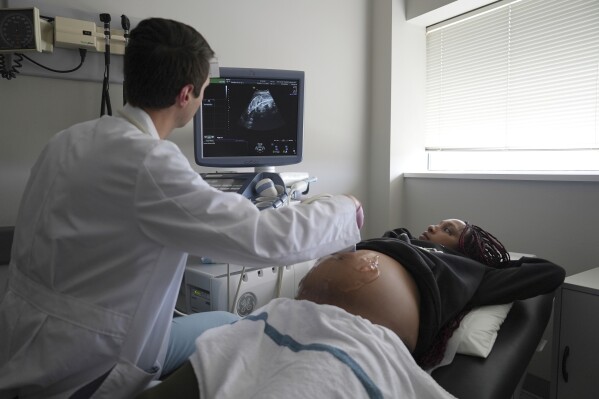 Areana Coles receives an ultrasound during a prenatal visit at the Oklahoma State University obstetrics and gynecology clinic in Tulsa, Okla., on Tuesday, July 16, 2024. (AP Photo/Mary Conlon)