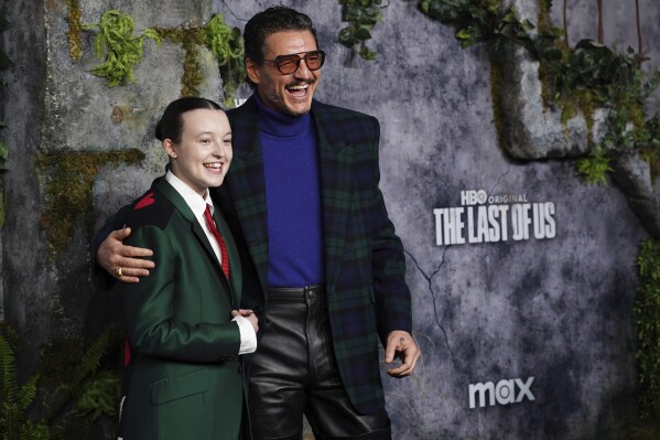Bella Ramsey, left, and Pedro Pascal arrive at the season two premiere of "The Last of Us" on Monday, March 24, 2025, at TCL Chinese Theatre in Los Angeles. (Photo by Jordan Strauss/Invision/AP)