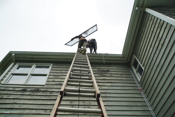 Solar panels are installed on a home in Chapel Hill, N.C., Wednesday, July 2, 2025. (AP Photo/Allen G. Breed)