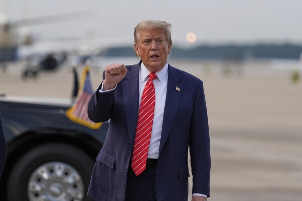 President Donald Trump gestures after arriving on Air Force One, Wednesday, June 25, 2025, at Joint Base Andrews, Md. (AP Photo/Alex Brandon)