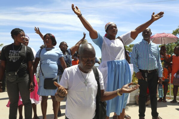 Pilgrims attend a Mass celebrating the Feast of Our Lady of Mount Carmel at the namesake church in the Pétion-Ville neighborhood of Port-au-Prince, Haiti, on Wednesday, July 16, 2025. (AP Photo/Odelyn Joseph)