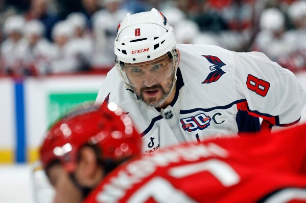 Washington Capitals' Alex Ovechkin (8) looks on during a faceoff against the Carolina Hurricanes during the first period of an NHL hockey game in Raleigh, N.C., Wednesday, April 2, 2025. (AP Photo/Karl DeBlaker, File)