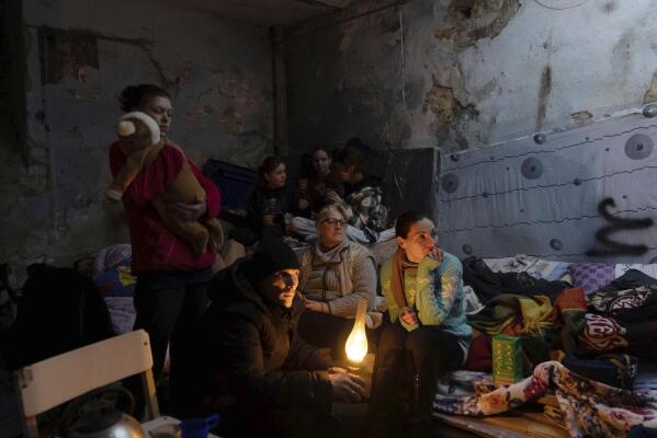 People settle in a bomb shelter in Mariupol, Ukraine, Sunday, March 6, 2022. (AP Photo/Evgeniy Maloletka)