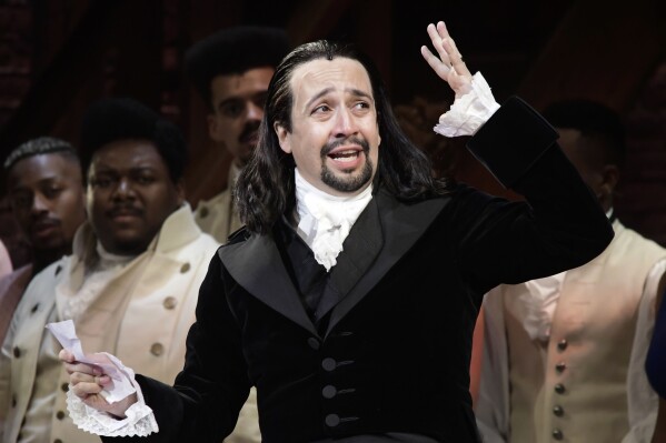 Lin-Manuel Miranda, composer and creator of the award-winning Broadway musical, Hamilton, offers a message of gratitude after receiving a standing ovation at the end of the play's premiere held at the Santurce Fine Arts Center, in San Juan, Puerto Rico, Jan. 11, 2019. (AP Photo/Carlos Giusti, file)