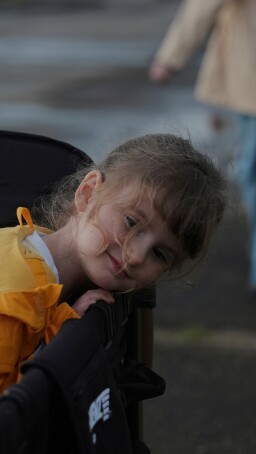 Eliza Ethridge, 5, rides in a wagon during a walk with her family, Thursday, April 10, 2025, in Evansville, Ind. (AP Photo/Joshua A. Bickel)