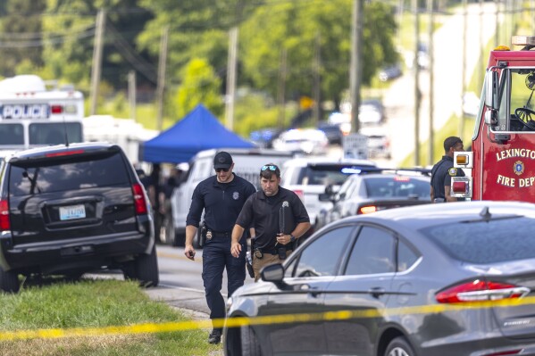 Law enforcement members respond to a shooting near Richmond Road Baptist Church in Lexington, Ky., Sunday, July 13, 2025. (Ryan C. Hermens/Lexington Herald-Leader via AP)