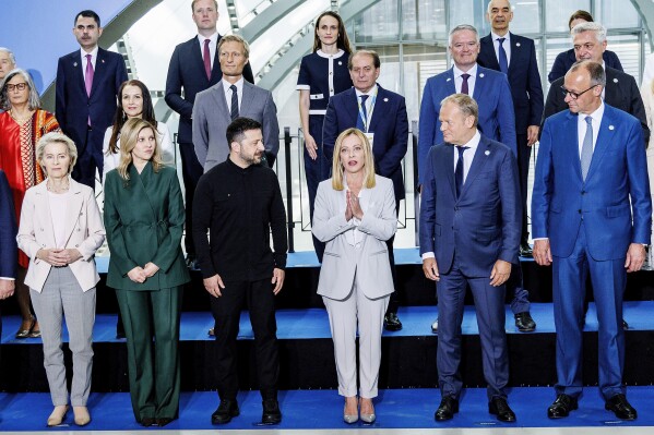 Front row from left, European Commission President Ursula von der Leyen, Olena Zelenska, Ukrainian President Volodymyr Zelenskyy, Italian Premier Giorgia Meloni, Polish Prime Minister Donald Tusk and German Chancellor Friedrich Merz pose for a family photo on the occasion of the Ukraine Recovery Conference at La Nuvola convention center in Rome, Thursday, July 10, 2025. (Roberto Monaldo/LaPresse via AP)