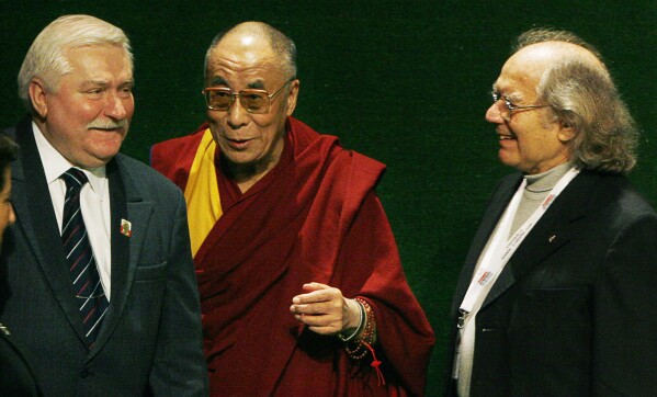 Nobel Peace Prize winner and former Polish President Lech Walesa, left, and fellow laureates Tibetan spiritual leader the Dalai Lama, center, and Adolfo Perez Esquivel greet each other in Gdansk, Poland, Dec. 5, 2008. (AP Photo/Czarek Sokolowski, File)