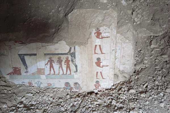 In this undated photo, hieroglyphs are revealed in the three new graves of senior statesmen found in the Dra' Abu al-Naga necropolis area in Luxor, Egypt. (Egypt Ministry of Tourism and Antiquities via AP)