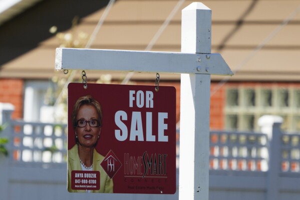 A for sale sign stands outside a residence in Niles, Ill., July 1, 2024. (AP Photo/Nam Y. Huh, File)