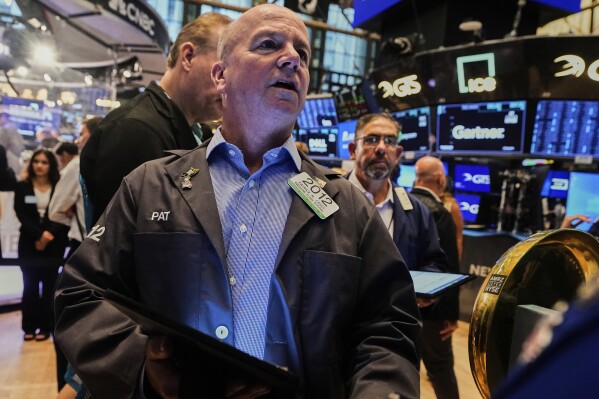 Trader Patrick Casey, left, works on the floor of the New York Stock Exchange, Monday, June 23, 2025. (AP Photo/Richard Drew)