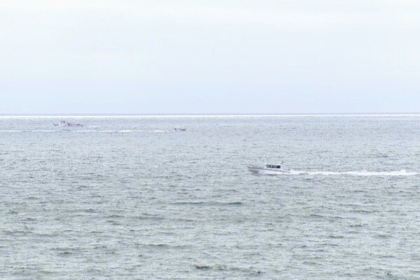 This image taken from video provided by KGTV shows where a twin-engine Cessna 414 crashed on Sunday, June 8, 2025, leaving a debris field about 3 miles west of Point Loma, a San Diego neighborhood that juts into the Pacific. (KGTV via AP)