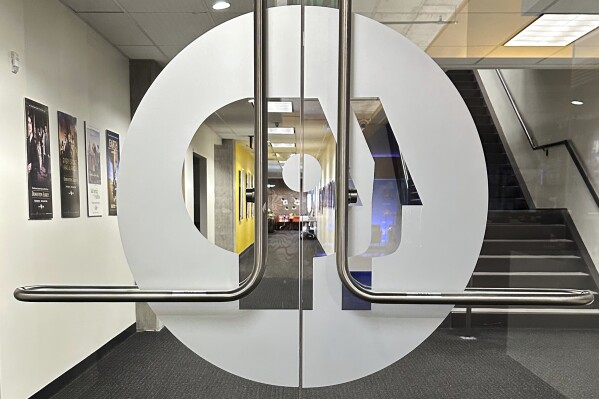 An entrance to the Arizona PBS offices in the Walter Cronkite School of Journalism and Mass Communication in Phoenix is seen Friday, May 2, 2025. (AP Photo/Katie Oyan)