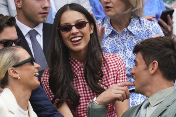 Singer Olivia Rodrigo smiles as she sits in the Royal Box at Centre Court during the Wimbledon Tennis Championships in London, Wednesday, July 2, 2025.(AP Photo/Kirsty Wigglesworth)