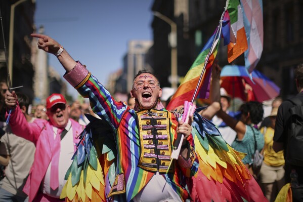 A participant in the Pride march cheers in Budapest, Hungary, Saturday, June 28, 2025. (AP Photo/Rudolf Karancsi)