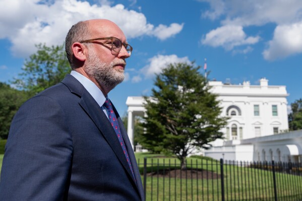 Office of Management and Budget Director Russell Vought walks at the White House, Monday, July 7, 2025, in Washington. (AP Photo/Alex Brandon, File)