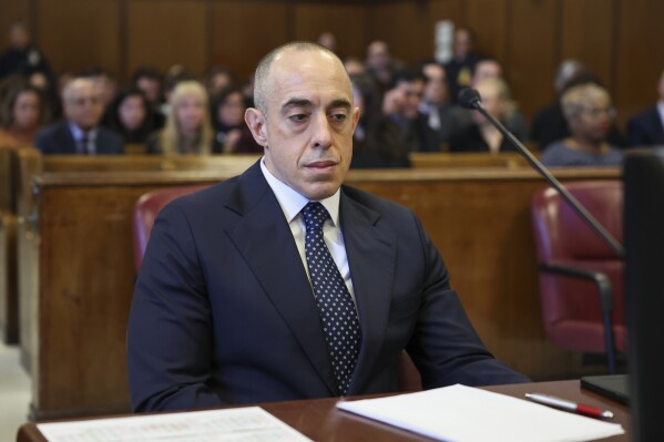 FILE - Attorney&nbsp;Emil&nbsp;Bove&nbsp;sits on the day of a sentencing hearing in the criminal case in which President-elect Donald Trump was convicted in 2024 on charges involving hush money paid to a porn star, outside of New York Criminal Court in Manhattan in New York City, Jan. 10, 2025. (Brendan McDermid, Pool Photo via AP, File)