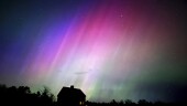 The northern lights flare in the sky over a farmhouse, late Friday, May 10, 2024, in Brunswick, Maine. (AP Photo/Robert F. Bukaty)