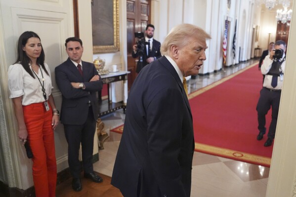 President Donald Trump is seen leaving after signing the "Halt All Lethal Trafficking of Fentanyl Act," during a ceremony in the East Room of the White House, Wednesday, July 16, 2025, in Washington. (AP Photo/Evan Vucci)