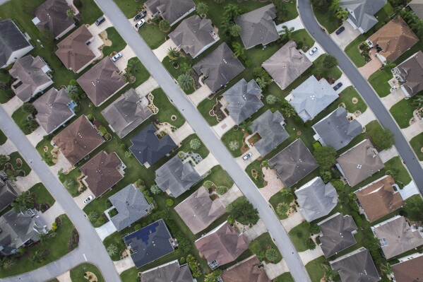 An aerial view shows homes in the sprawling retirement community known as The Villages, Fla., Sunday, Sept. 15, 2024. (AP Photo/Rebecca Blackwell)