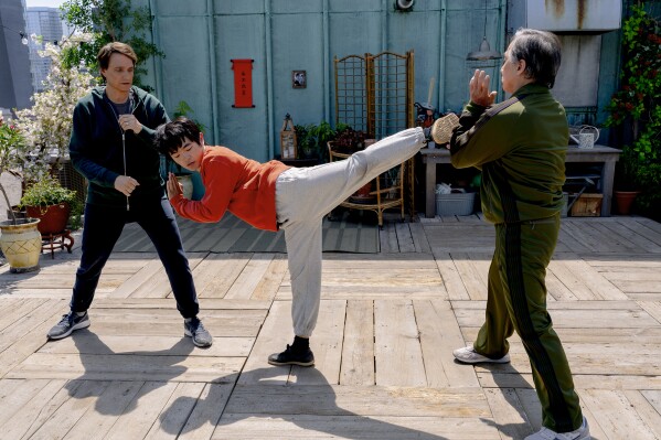 Ralph Macchio, Ben Wang and Jackie Chan in a scene from "Karate Kid: Legends." (Jonathan Wenk/Sony Pictures via AP)