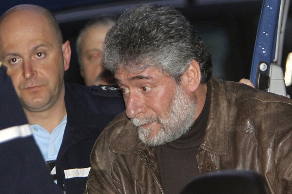 Georges Ibrahim Abdallah arrives at the Pau appeal court, southwestern France, Thursday Feb. 18, 2010. (AP Photo/Bob Edme, File)