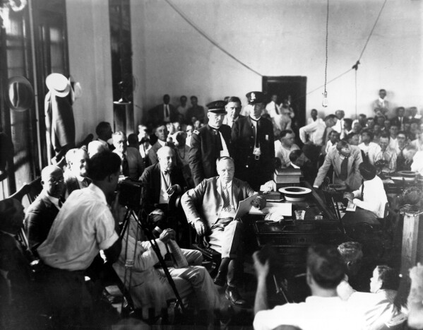 Judge John T. Raulston of Winchester, Tenn., holds the decision in the Tennessee vs. John Scopes case at the Rhea County Courthouse in Dayton, Tenn., on July 17, 1925. (AP Photo/File)