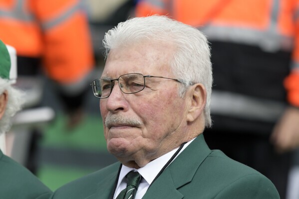 Former New York Jets defensive tackle Gerry Philbin sits on the bench prior to an NFL football game between the New York Jets and the Indianapolis Colts, Sunday, Oct. 14, 2018, in East Rutherford, N.J. (AP Photo/Bill Kostroun, File)