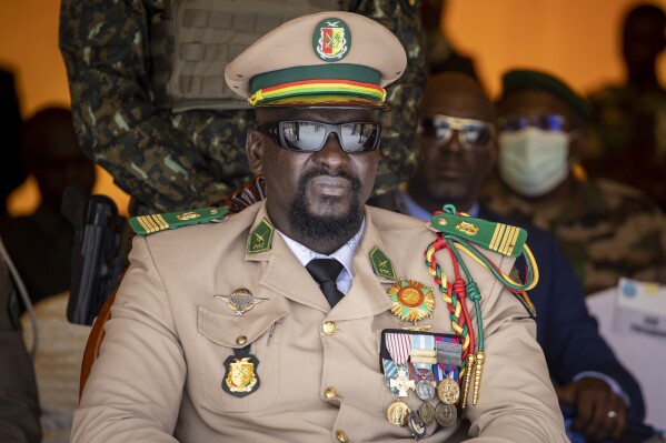 Guinea's junta leader Col. Mamady Doumbouya watches over an independence day military parade in Bamako, Mali on Sept. 22, 2022. (AP Photo, File)