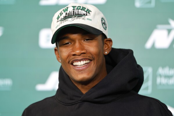 New York Jets wide receiver Garrett Wilson answers questions during a news conference following NFL football practice, May 21, 2025, in Florham Park, N.J. (AP Photo/Noah K. Murray, File)