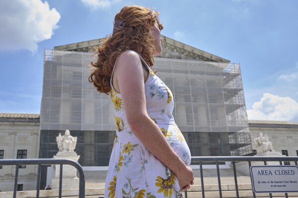 Mairelise Robinson, a U.S. citizen who is 6 months pregnant, attends a protest in support of birthright citizenship, outside of the Supreme Court in Washington, May 15, 2025. (AP Photo/Jacquelyn Martin, File)