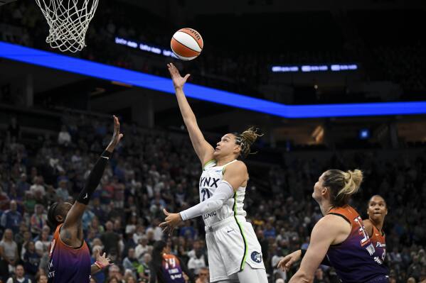Minnesota Lynx forward Kayla McBride (21) scores a layup against the Phoenix Mercury early in the first quarter of a WNBA basketball game, Wednesday, July 16, 2025 at Target Center in Minneapolis. (Aaron Lavinsky/Star Tribune via AP)