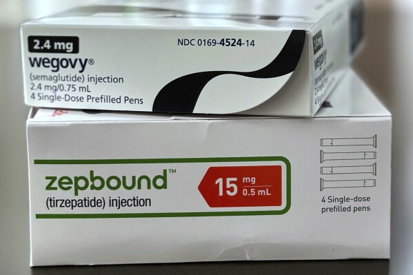 Boxes for the medications Wegovy and Zepbound are arranged for a photograph in California on Thursday, May 8, 2025. (AP Photo/JoNel Aleccia, File)