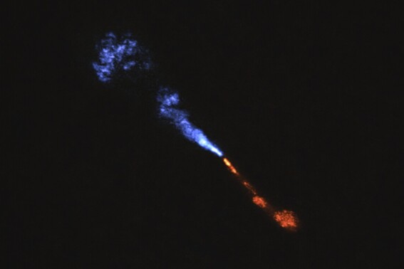 This image provided by the European Southern Observatory on Tuesday, July 15, 2025, shows jets of silicon monoxide blowing away from the baby star HOPS-315. (ALMA(ESO/NAOJ/NRAO)/M. McClure et al. via AP)