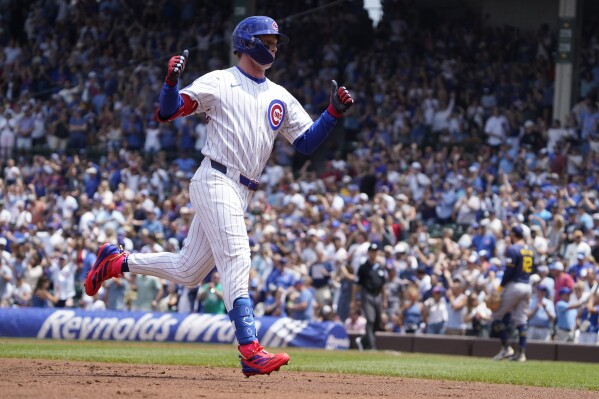 Chicago Cubs' Pete Crow-Armstrong gestures after hitting a two-run home run against the Milwaukee Brewers during the first inning of a baseball game Thursday, June 19, 2025, in Chicago. (AP Photo/David Banks)