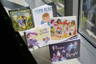 A selection of books featuring LGBTQ characters that are part of a Supreme Court case are pictured, April, 15, 2025, in Washington. (AP Photo/Pablo Martinez Monsivais, File)