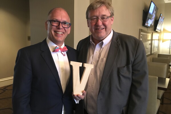 This April 2016 photo provided by Rick Hodges shows Jim Obergefell, left, and Rick Hodges posing for a picture in Columbus, Ohio. (Rick Hodges via AP)